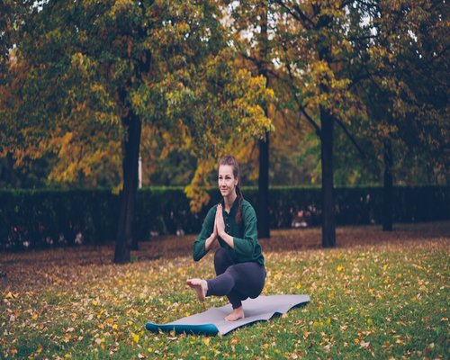 Person doing yoga meditation outdoors in nature